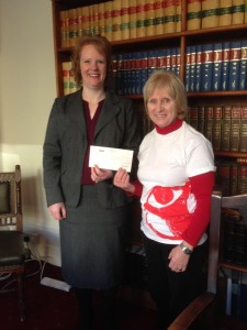 Jennifer Carpenter of Adams Harrison presents cheque to Lynne Taylor of Save the Children